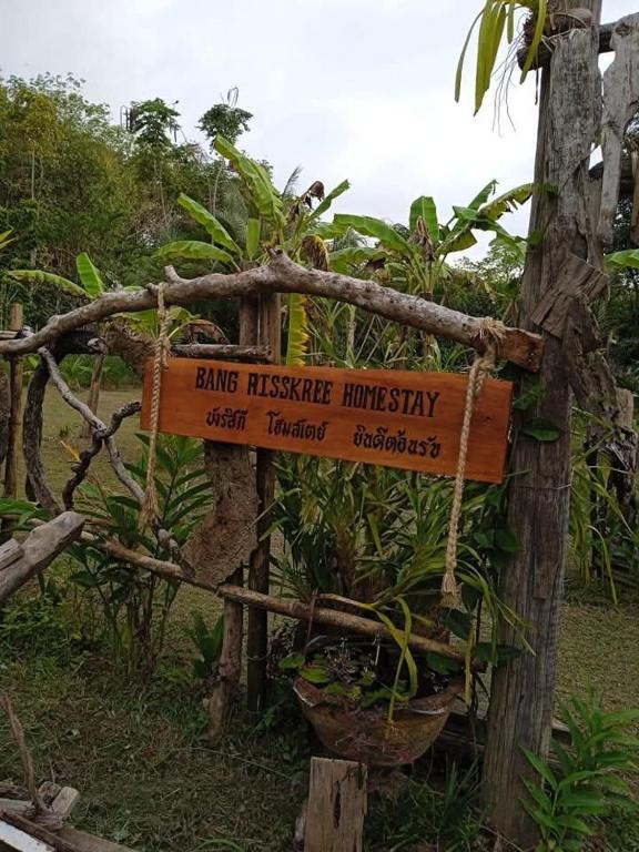 a sign that says king hakusanimpressionhysicalimpysicalysicalysical at Bang risskee home stay1 in Ko Yao Noi