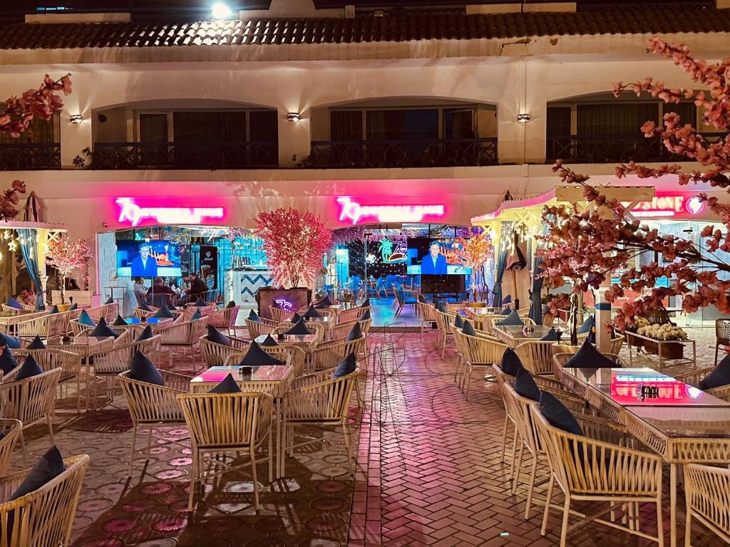 a banquet hall with chairs and tables and lights at Apartments in Ain Sokhna in Porto in Ain Sokhna