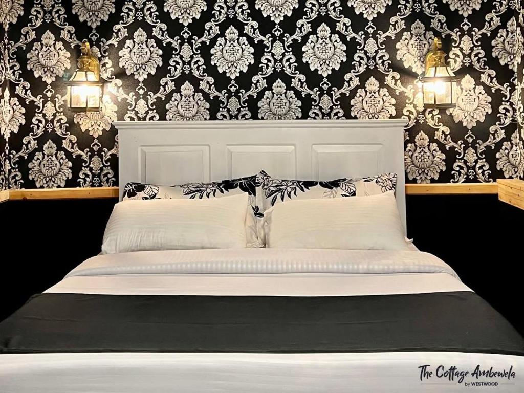 Postel nebo postele na pokoji v ubytování The Cottage Ambewela by 47