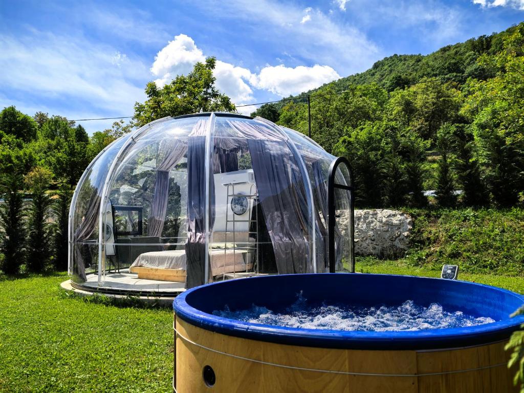 a hot tub in a dome in a yard at ZEN Relaxing Village in Cetinje
