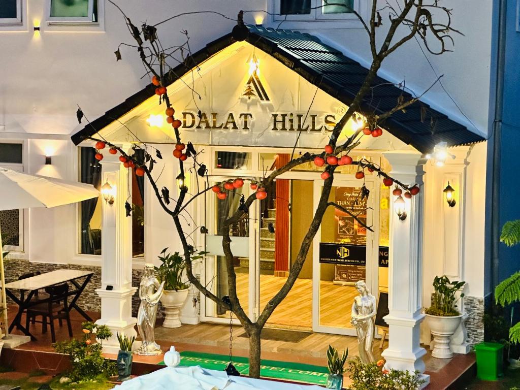 a small gingerbread house in front of a restaurant at Dalat Hills Apartment in Da Lat