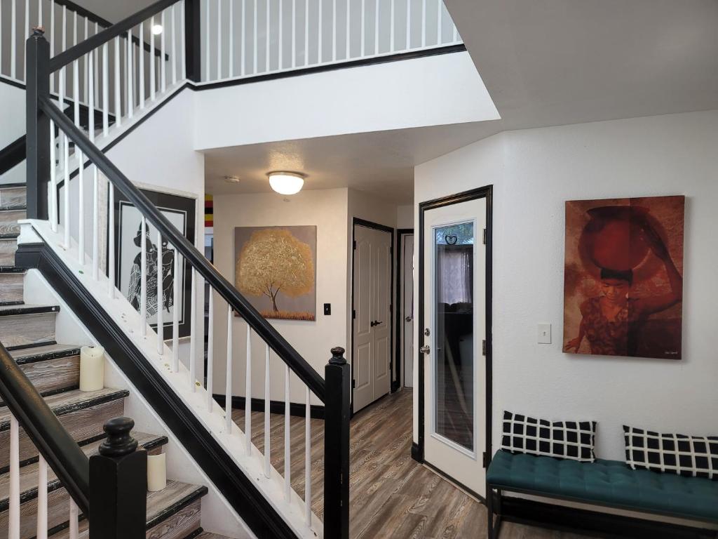 a staircase in a home with white walls at Denver Layover B&B in DEN