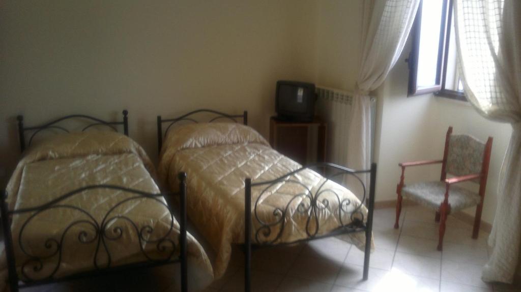 Postel nebo postele na pokoji v ubytování Agriturismo La Palombara