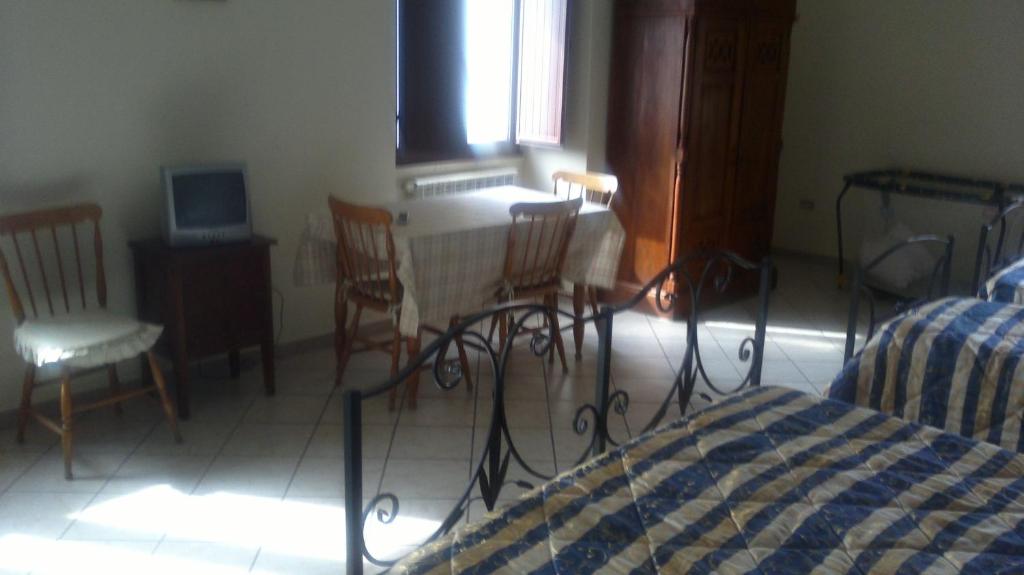 Postel nebo postele na pokoji v ubytování Agriturismo La Palombara