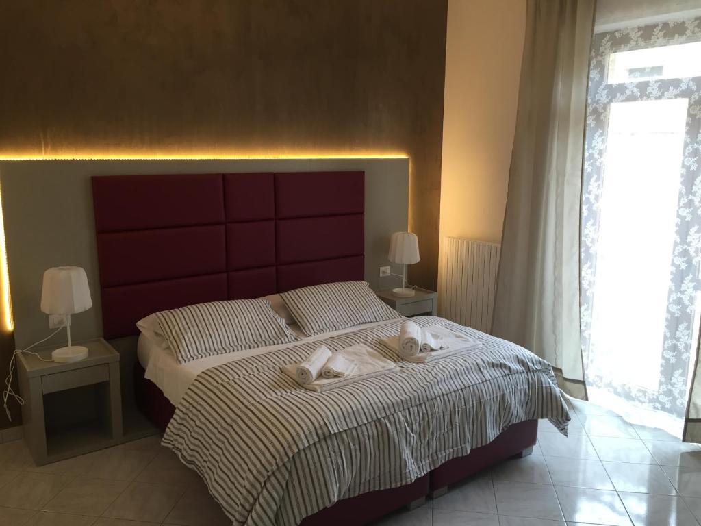 Postel nebo postele na pokoji v ubytování Sant'Oronzo B&B