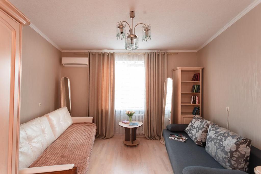 a living room with a couch and a window at Standard 1-bd Apartment LAVINA in Sumy