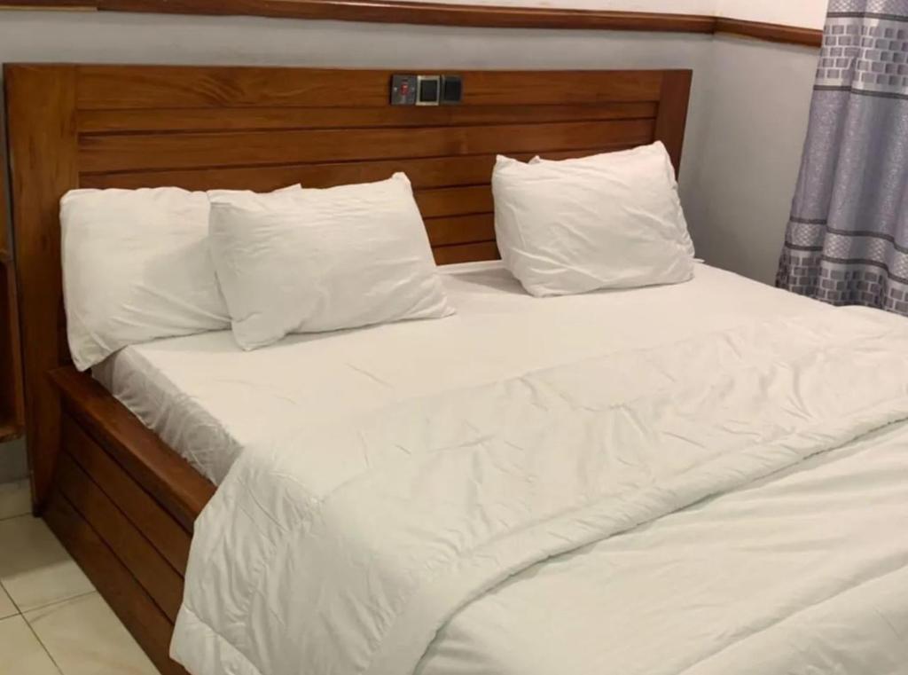 Postel nebo postele na pokoji v ubytování NBS Hotel