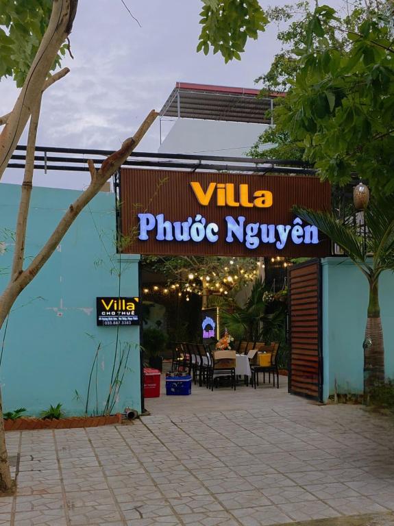 a restaurant with a sign that reads villa private kitchen at Villa Phước Nguyên in Ấp Bình Hưng