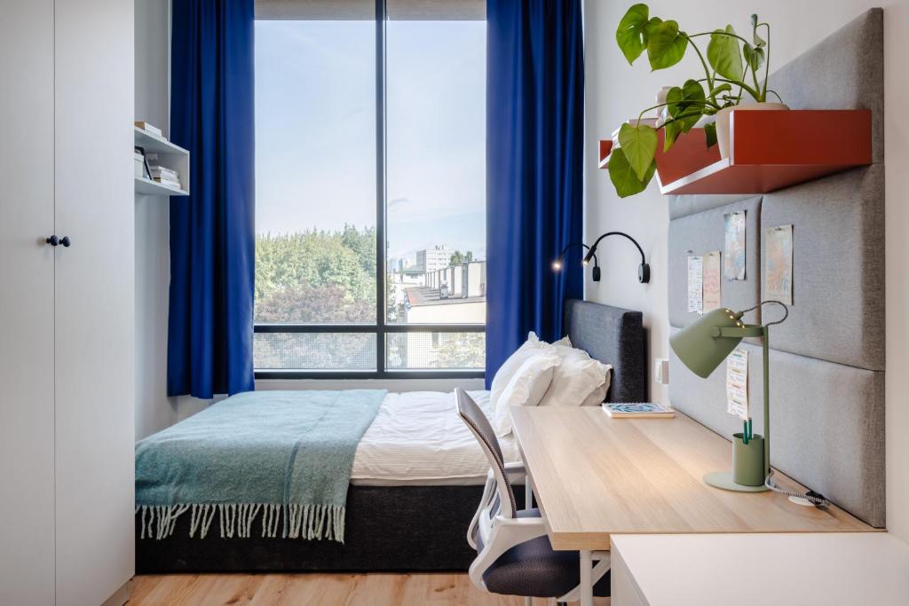 Postel nebo postele na pokoji v ubytování Sky Apartments