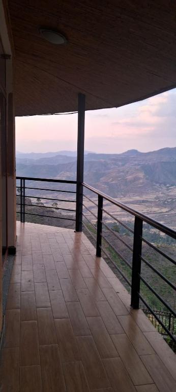 a balcony with a view of the mountains at Lalibela Circle Guest House in Lalibela