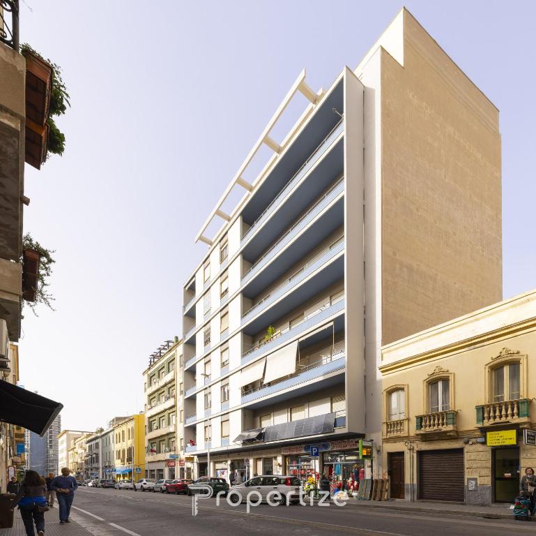 a large building on the side of a city street at Central Cagliari by Propertize in Cagliari