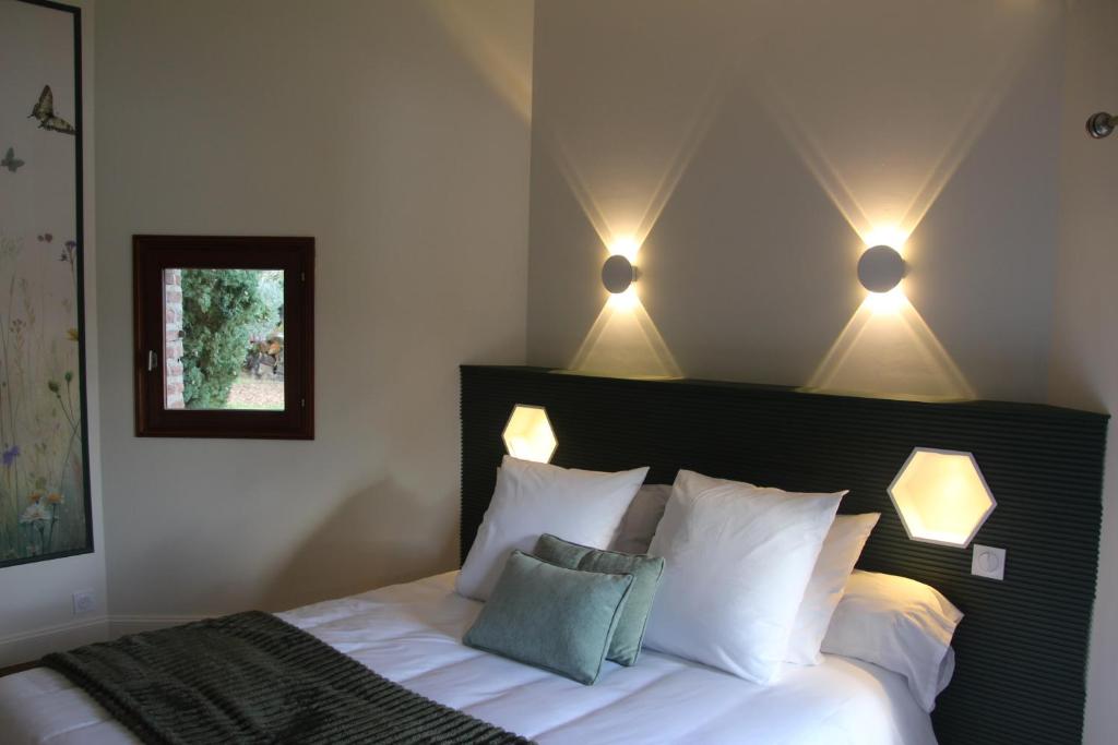 Ένα ή περισσότερα κρεβάτια σε δωμάτιο στο A L'Esquirot