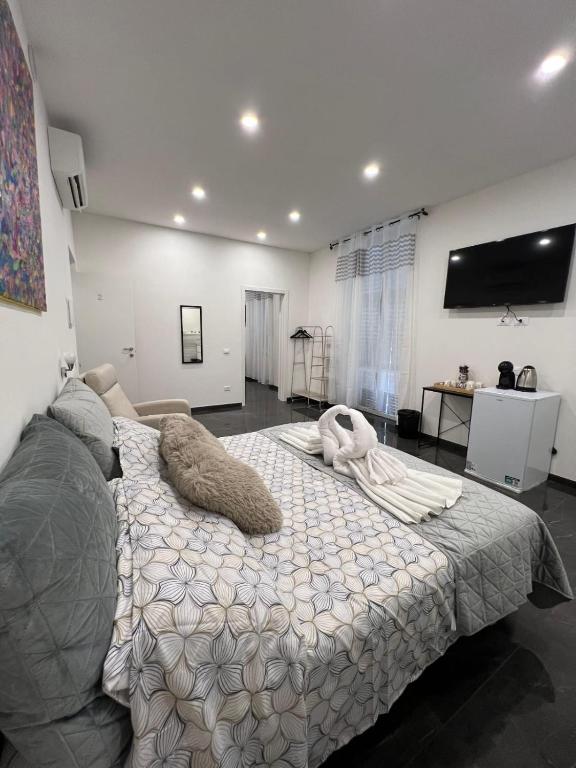 Ένα ή περισσότερα κρεβάτια σε δωμάτιο στο Onda di mare