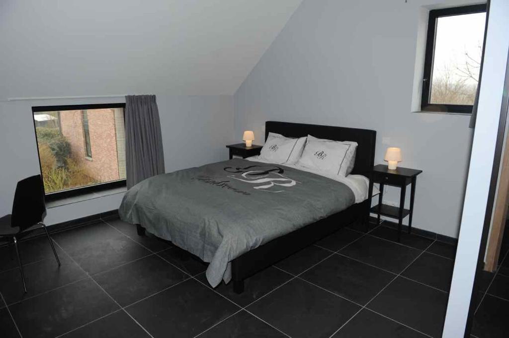 Voodi või voodid majutusasutuse Gîte Fenêtres sur cour - Genappe toas