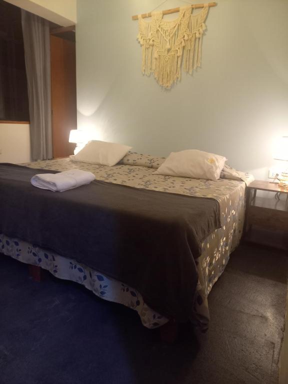 a bedroom with a large bed in a room at Hospedaje Hamuy's Lodge in Ica