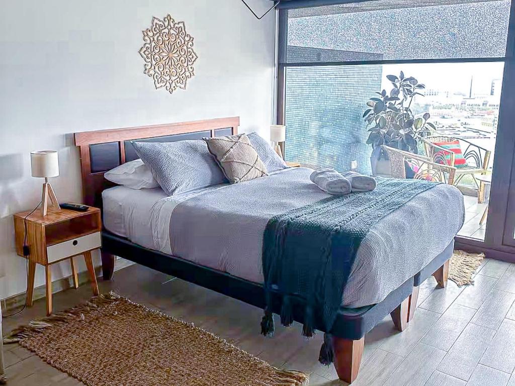 Ένα ή περισσότερα κρεβάτια σε δωμάτιο στο HOM I Estudio con preciosa Vista al mar Valparaiso