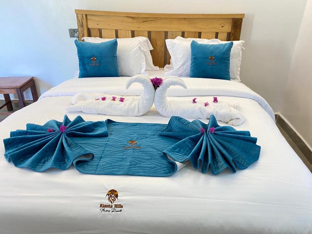 Ένα ή περισσότερα κρεβάτια σε δωμάτιο στο Rianta Hills Mara Resort