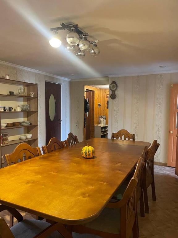 a dining room table with a pumpkin on top of it at CenterHouse1 in Karakol