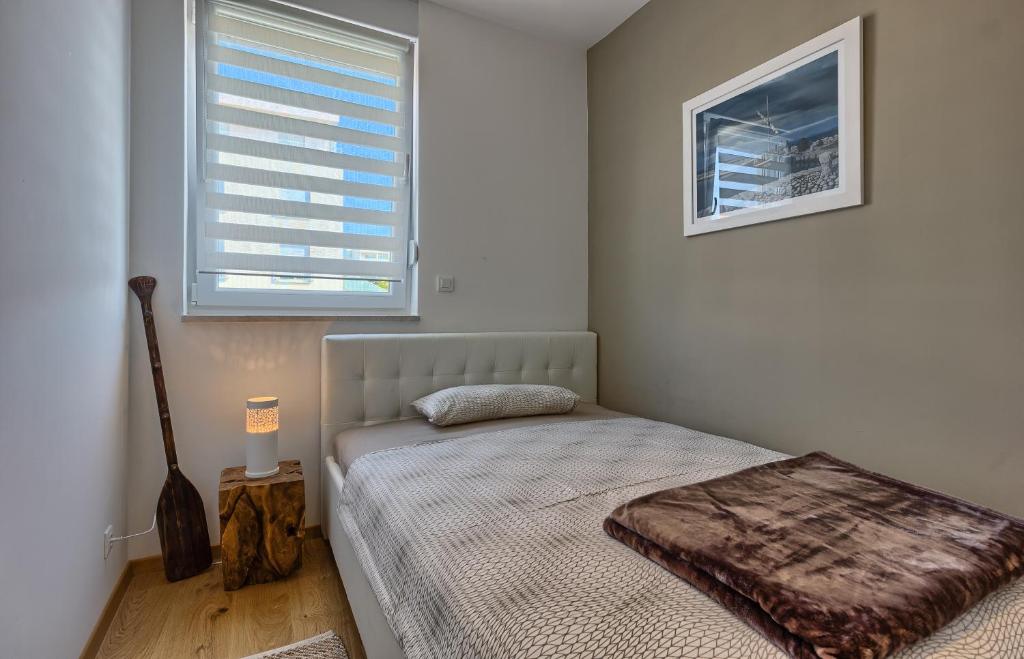 Posteľ alebo postele v izbe v ubytovaní Seaside Apartments