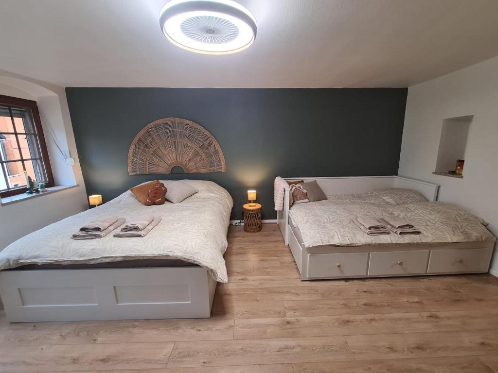 Ένα ή περισσότερα κρεβάτια σε δωμάτιο στο Évasion à Saverne - entre nature et douceur de vivre