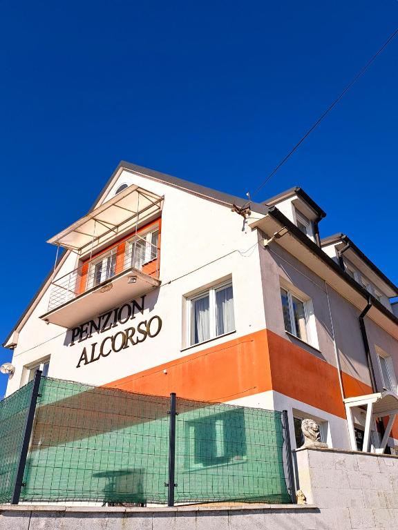 a building with a sign that reads reunion albuquerque at Alcorso Pension in Banská Bystrica
