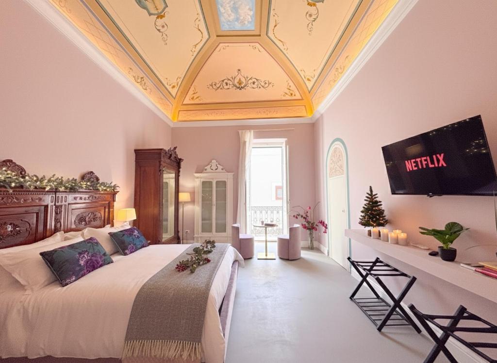 Una cama o camas en una habitación de Don Nicola Elegant and Luxury Apartments - Centro Storico