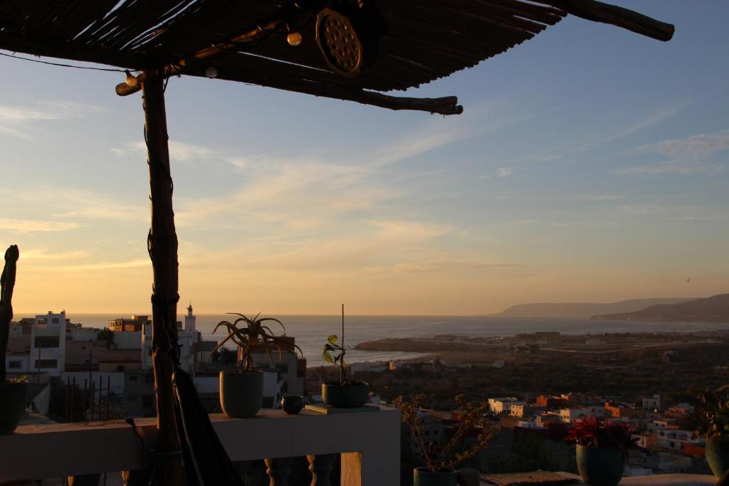 a view of a city from a rooftop at Agadir Funky Chill Guesthouse Surf, Horse, Music adventures in Aourir