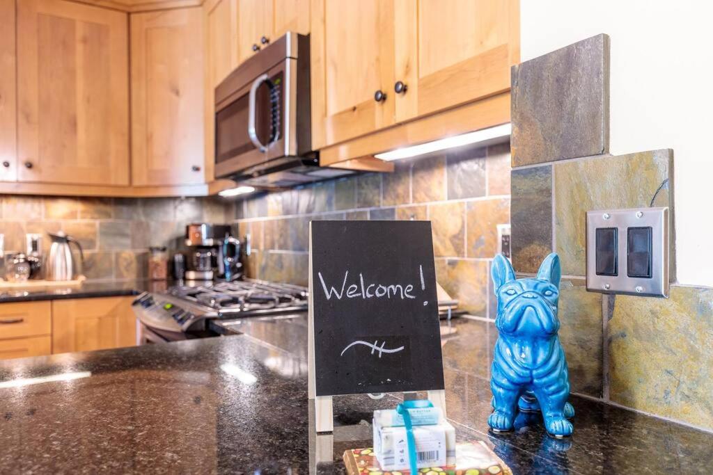 a blue cat statue sitting on a counter in a kitchen at Spring Creek Serenity at Rundle Cliffs Lodge in Canmore