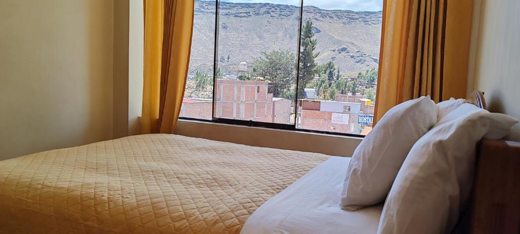 Ένα ή περισσότερα κρεβάτια σε δωμάτιο στο El caminante del colca
