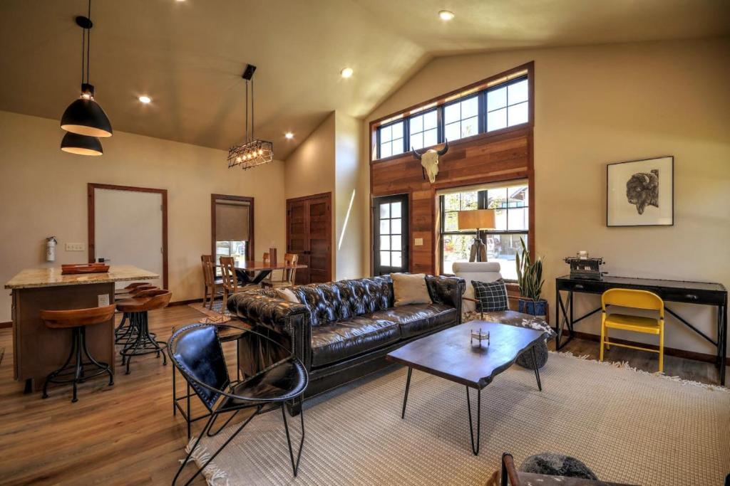 a living room with a couch and a table at Montana Mountain Escape in Red Lodge