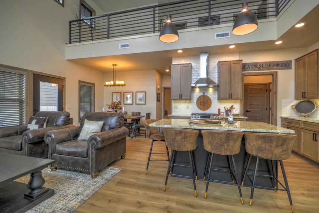 a kitchen and living room with a table and chairs at Beartooth Dream, Red Lodge in Red Lodge