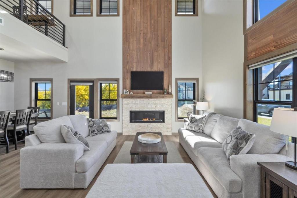 a living room with a couch and a fireplace at Beartooth Mountain Lodge - Private hot tub - $50 dollar with 3 night stay in Red Lodge