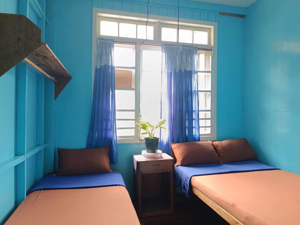 Postel nebo postele na pokoji v ubytování A-Seven House Sagada