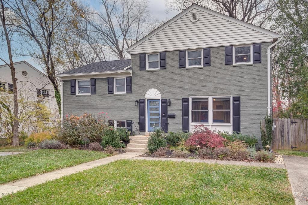 a gray house with a blue door at Upscale Family Retreat Near DC and Georgetown! in North Bethesda