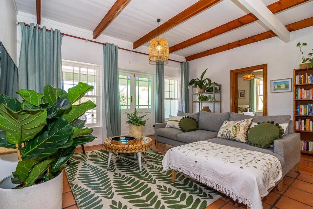 a living room with a couch and a table at Casa Querida in Stanford