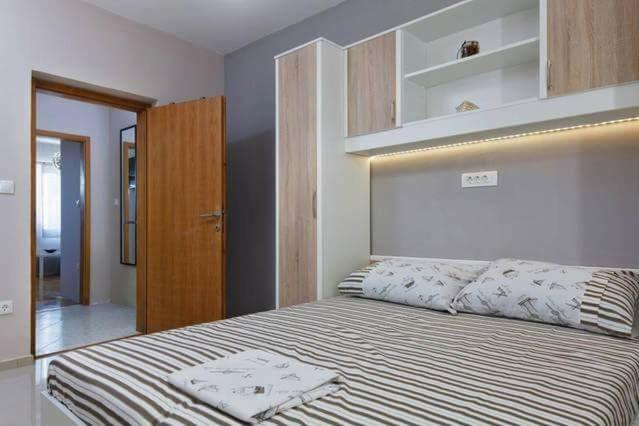 Postel nebo postele na pokoji v ubytování Apartments Romantica