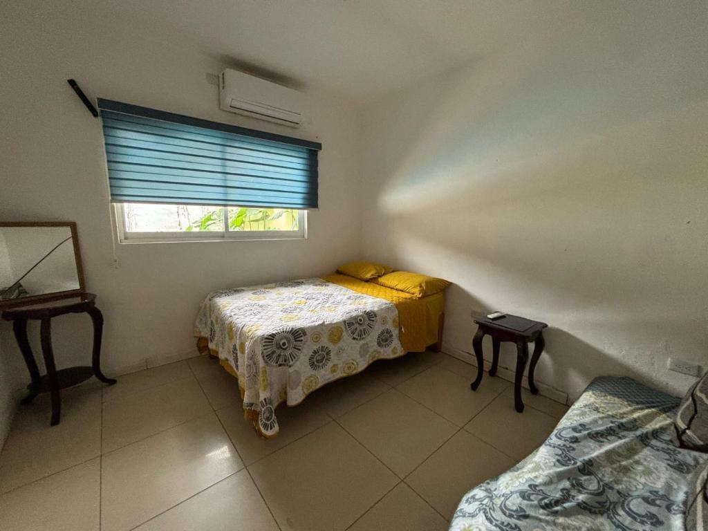 Ένα ή περισσότερα κρεβάτια σε δωμάτιο στο Departamento con palapa, 2 cuartos