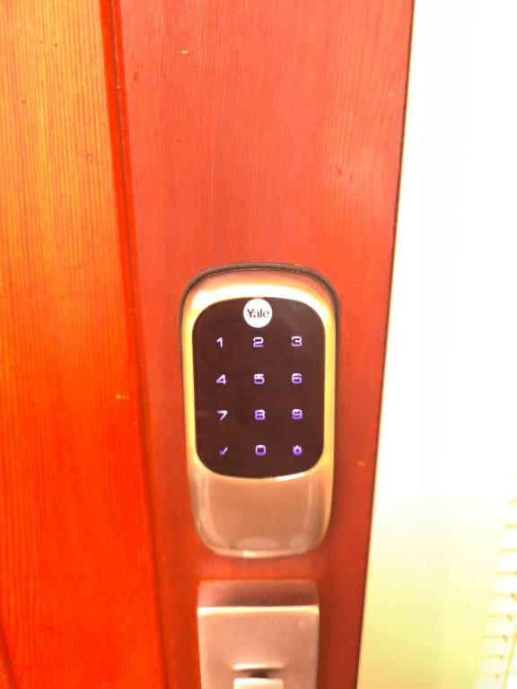 a close up of a remote control in an elevator at Enjoy 4br home with lots of comfort & convenience in Taupo
