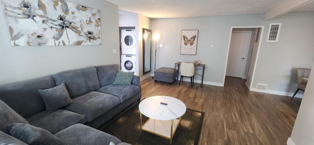 a living room with a couch and a table at Cozy 2bdr Beach home in Huntington Beach
