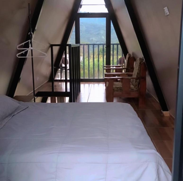 Ένα ή περισσότερα κρεβάτια σε δωμάτιο στο Cabaña Alpina Bella Vista