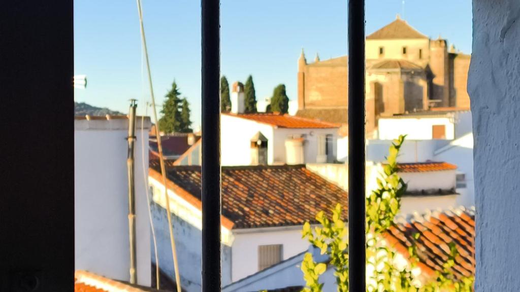 a view from a window of a city with roofs at Apartamento en Cazalla de la Sierra in Cazalla de la Sierra