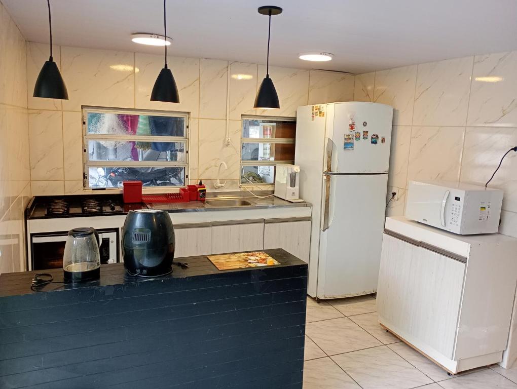 Кухня или мини-кухня в Aconchego
