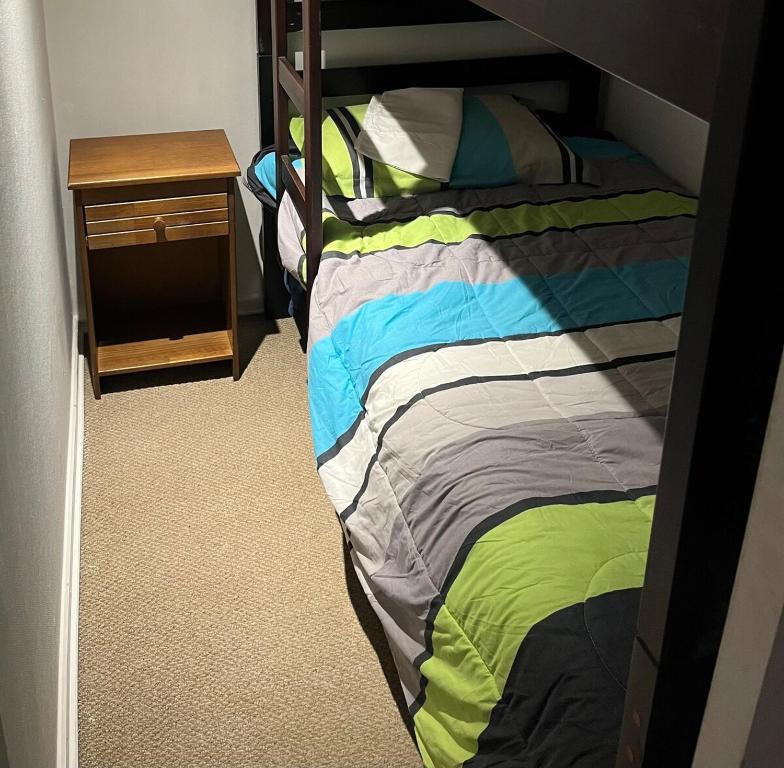 Ένα ή περισσότερα κρεβάτια σε δωμάτιο στο Gran departamento frente a la playa