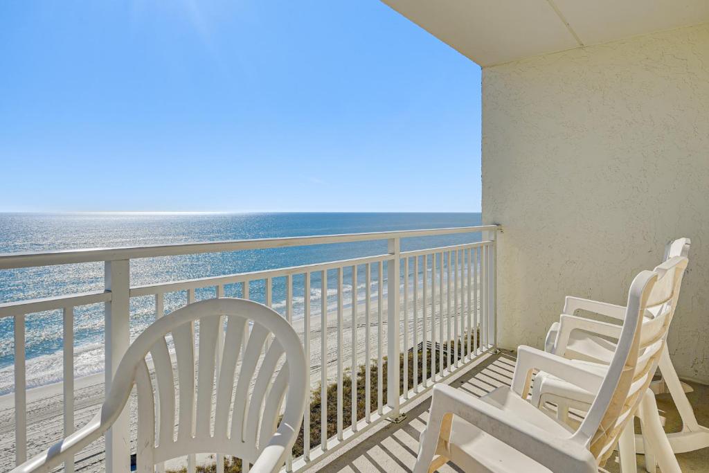 two white chairs on a balcony with the ocean at Ocean-View Penthouse Condo in North Myrtle Beach! in Myrtle Beach