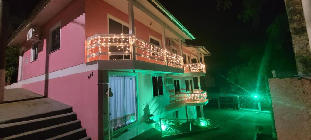 a building with lights on the balconies at night at Terraço do Sol Apt 01 in Marcelino Ramos