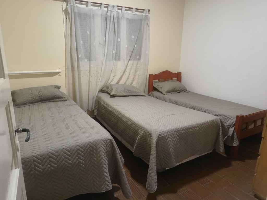 Ένα ή περισσότερα κρεβάτια σε δωμάτιο στο Casa amplia en Mogotes EL isa