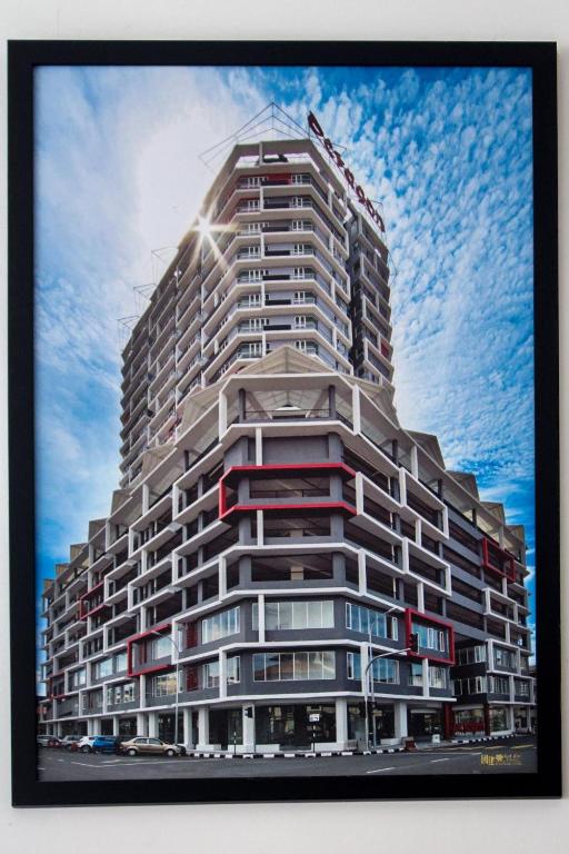 a tall apartment building with the sky in the background at Octagon Premium Ipoh Town Center 2BR 121 by Grab A Stay in Ipoh