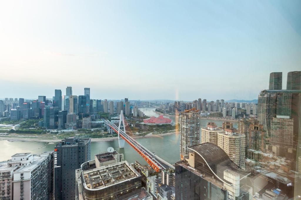 an aerial view of a city with a bridge at Guyu B&B in Chongqing