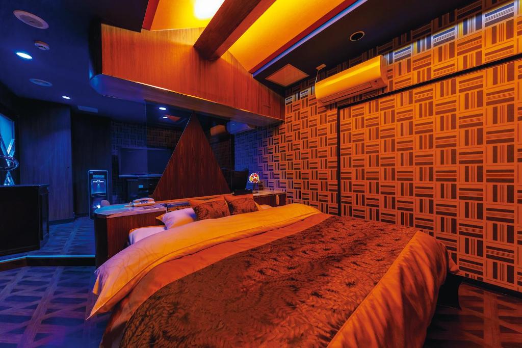 En eller flere senge i et værelse på Himeji Park Hotel (Adult Only)