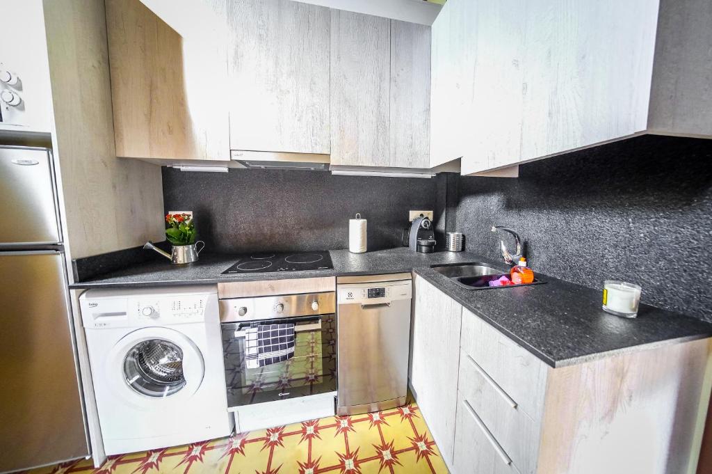 Kuchyň nebo kuchyňský kout v ubytování Apartaments Cal Xic